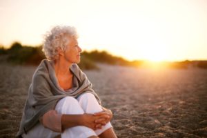 Oregon senior sitting on the beach